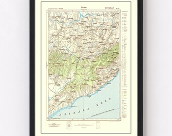 May include: A vintage map of Erbaa, Turkey, printed in black, brown, green, and blue. The map shows the surrounding area, including the Black Sea, and features a legend and scale.