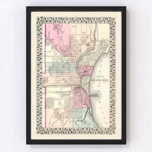 May include: An antique map of Milwaukee, Wisconsin, with a decorative floral border. The map shows the city's streets and waterways, with labels for different neighborhoods and landmarks. The map is printed in black and white, with some areas highlighted in pink, green, and blue.