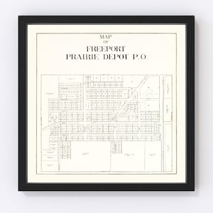 May include: A framed map of Freeport Prairie Depot P.O. in black and white. The map features a detailed layout of the area, including streets and numbered plots. The frame is black, and the map is printed on a cream-colored background.
