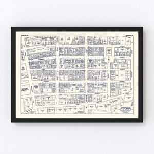 May include: A vintage map of Roanoke, Virginia, showing the city's streets and blocks. The map is printed in blue ink on a white background. The map includes street names, block numbers, and the names of businesses and organizations.