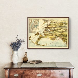 May include: A vintage map of Long Island, New York, with a detailed illustration of the coastline and surrounding areas. The map is framed in a brown wooden frame and features a light blue and green color scheme.