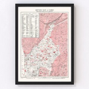 May include: A vintage map of Cairo, Egypt, with red and pink markings. The map is titled "Bounds Map of Cairo" and includes a key with a list of locations. The map is printed on white paper and framed in black.