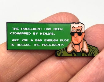 Bad Dudes pour NES - « Êtes-vous un type assez méchant pour sauver le président ? » épingle ou aimant - art rétro gaming NES