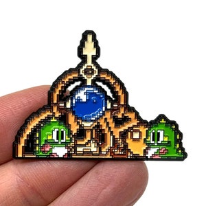 Puzzle Bobble / Bust-A-Move - arcade and console puzzle classic, Pointer machine and Bub(s) 2” enamel pin  -  retro arcade gaming art