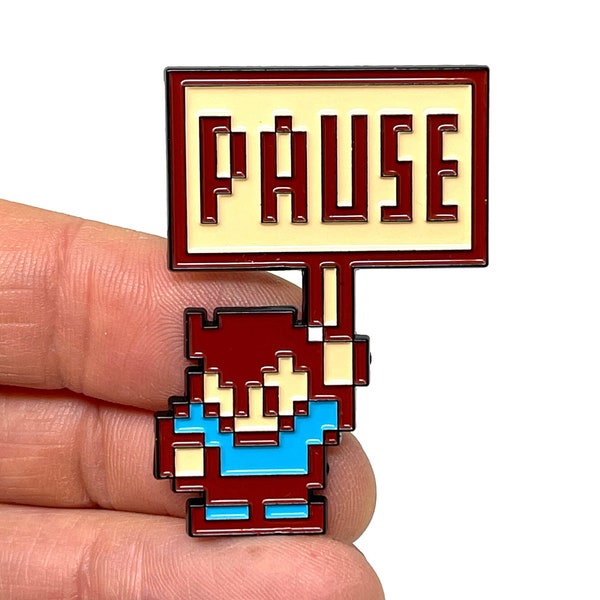 StarTropics for NES, pause screen Mike Jones holding the pause sign, 1.85” enamel pin and magnet - Classic NES retro gaming art