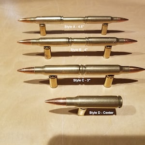 May include: Four different styles of brass bullet shell cabinet door pulls. The pulls are 4.5 inches, 4 inches, 3 inches, and center mounted.  Style A - 4.5", Style B - 4", Style C - 3", Style D - Center