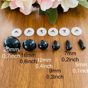 May include: A set of six black plastic safety eyes in graduated sizes from 5mm to 20mm, each paired with a clear plastic washer. The sizes are labeled as 20mm (0.7 inch), 16mm (0.6 inch), 12mm (0.4 inch), 9mm (0.3 inch), 7mm (0.2 inch), and 5mm (0.1 inch).