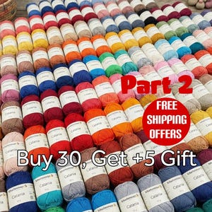 Peut inclure: Plusieurs pelotes de laine Catania de couleurs variées, notamment rose, bleu, jaune, orange et marron. Le texte sur l'image indique "Part 2" et "Buy 30, Get +5 Gift".