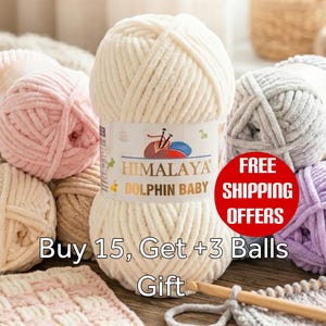 May include: A central skein of cream-colored chenille yarn labeled Himalaya Dolphin Baby, surrounded by various pastel-colored yarn balls in pink, beige, gray, and lavender. A wooden crochet hook rests on a partially finished knitted square.