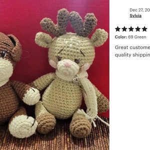 May include: Two handmade crochet stuffed animals. One is a brown dog with a cream-colored face stripe and scarf. The other is a light green deer with brown antlers, pink cheeks, and a cream-colored scarf. Both have embroidered facial features.