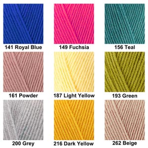 May include: A grid of nine yarn color samples featuring 141 Royal Blue, 149 Fuchsia, 156 Teal, 161 Powder, 187 Light Yellow, 193 Green, 200 Grey, 216 Dark Yellow, and 262 Beige. Each square displays the specific color name and number below it.