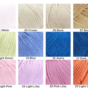May include: A grid of twelve yarn skeins in various colors, each labeled with a number and name: 01 White, 03 Cream, 05 Bone, 07 Beige, 11 Light Green, 15 Blue, 16 Jeans, 17 Dark Jeans, 18 Light Pink, 19 Light Lilac, 20 Pink Lilac, 23 Light Orange.