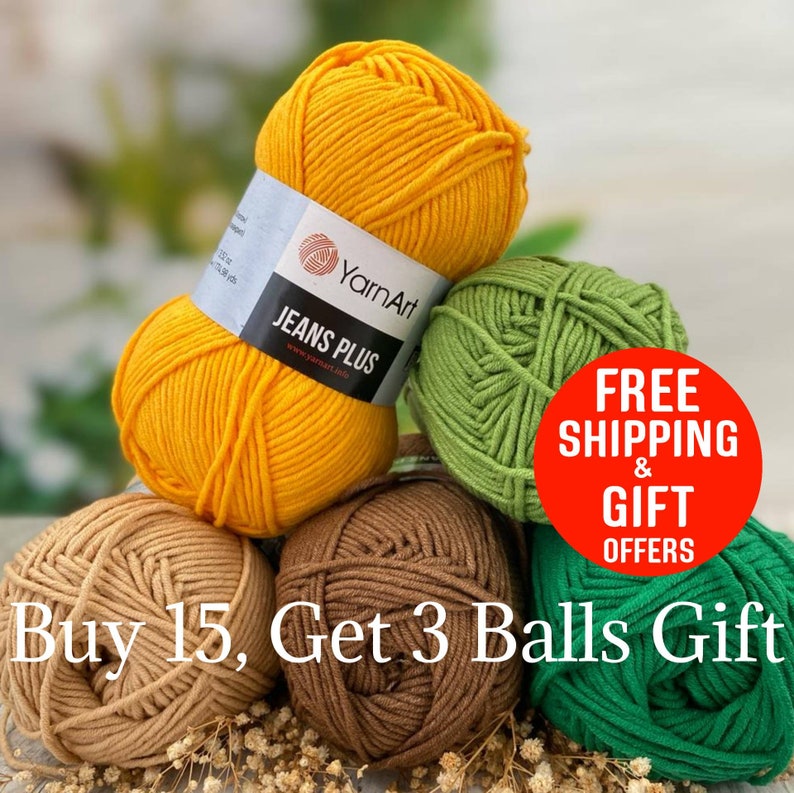 May include: A collection of colorful YarnArt Jeans Plus yarn balls. The image features balls in yellow, green, brown, and tan. The text on the yarn label reads "JEANS PLUS". The image also includes text that says "Buy 15, Get 3 Balls Gift".