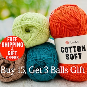 May include: A collection of colorful yarn balls in shades of green, orange, teal, and brown. The orange ball has a label that reads "COTTON SOFT." The image also includes text that says "Buy 15, Get 3 Balls Gift."