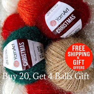 May include: A selection of YarnArt Christmas yarn balls in festive colours: red, green, and gold. Each ball has a label with the brand name and product information. The image also includes text that says "Buy 20, Get 4 Balls Gift."