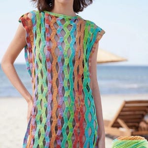 May include: A sleeveless crochet tunic featuring a vertical wavy openwork pattern in a variegated color palette of orange, lime green, turquoise, and purple. The garment has a round neckline and a loose, straight silhouette with wide arm openings.