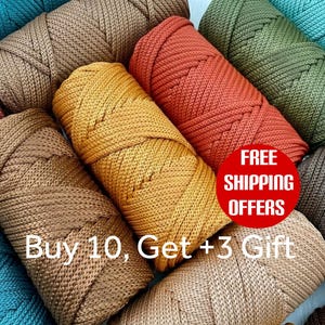 May include: Assortment of colorful spools of cord in shades of brown, gold, orange, and green. The image includes text that reads "Buy 10, Get +3 Gift" and a red circle with the words "FREE SHIPPING OFFERS".