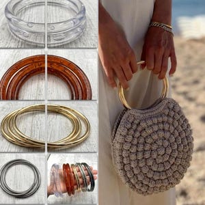 May include: A round, beige crocheted handbag featuring a textured, bobble-stitch pattern and two circular handles. The set includes various circular handle options in clear, amber, gold, and black finishes, suitable for crafting or bag replacement.