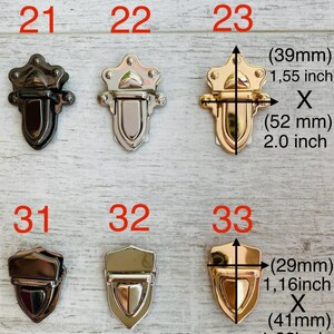 May include: A selection of decorative metal clasps in black, silver, and gold finishes. The clasps are shown in various shapes and sizes, with measurements in inches and millimeters. The image includes the numbers 21, 22, 23, 31, 32, and 33.