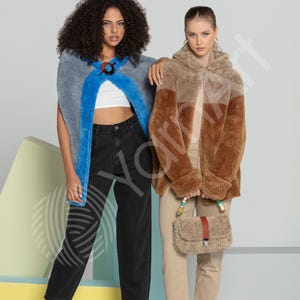 May include: A grey and blue sleeveless wrap with a dark circular clasp, worn over a white crop top and black jeans. Beside it, a hooded brown and tan faux-fur jacket with a matching fuzzy handbag featuring a brown leather strap and beads.