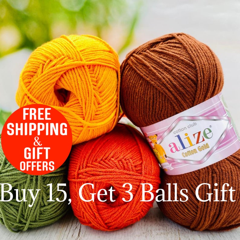 May include: Four skeins of Alize Cotton Gold yarn in yellow, brown, orange, and olive green. The brown skein features a label with the text cotton club alize Cotton Gold. A red circular graphic displays text about shipping and gift offers.