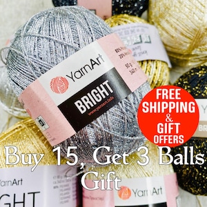 May include: A close-up of a silver yarn ball with glitter, labeled "YarnArt BRIGHT" with the website address "www.yarnart.info". The yarn ball is surrounded by other yarn balls in gold, black, and white. The image also includes a red circle with the text "FREE SHIPPING & GIFT OFFERS" and the text "Buy 15, Get 3 Balls Gift".
