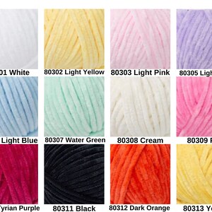May include: A collection of colorful yarn skeins in various shades, including white, yellow, pink, lilac, blue, green, cream, orange, and purple. Each skein is labeled with a number and color name.