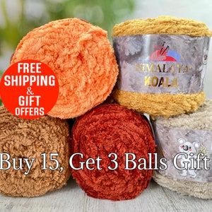 May include: Four skeins of fuzzy, textured yarn in shades of orange, mustard yellow, brown, and beige. The mustard yellow and beige skeins feature paper labels with the text Himalaya Koala and a koala illustration. The yarn has a soft, plush appearance.