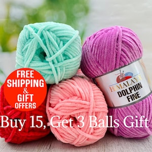 May include: A collection of colorful yarn balls in shades of red, pink, teal, and purple. The yarn is soft and plush, with a label on one ball that reads "Himalaya Dolphin Fine". The image also includes text that says "Buy 15, Get 3 Balls Gift".