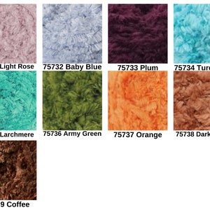 May include: A collection of nine textured yarn samples in various colors labeled with numbers and names: 75731 Light Rose, 75732 Baby Blue, 75733 Plum, 75734 Turquoise, 75735 Larchmere, 75736 Army Green, 75737 Orange, 75738 Dark Beige, and 75739 Coffee.