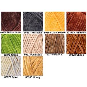 May include: A collection of ten skeins of plush yarn in various colors, including Peanut Brown, Antracite, Dark Yellow, Cinnamon, Grass, Chickpea, Brown 2, Choco, Bone, and Honey. Each skein is labeled with a corresponding number.