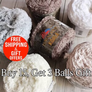 May include: Five balls of Himalaya Koala yarn in shades of white, light gray, and brown. Each ball features a soft, fuzzy, textured surface. The central yarn label displays the brand name Himalaya Koala with a koala illustration and logo.