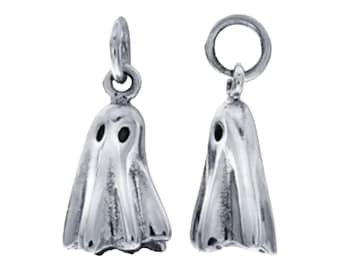 May include: Two silver ghost charms with a loop for attaching to a bracelet or necklace. The charms are detailed with a ghost shape and two black eyes.