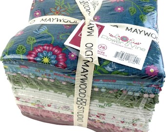May include: A stack of 26 fabric quarter pieces wrapped in clear plastic. The fabric features floral patterns in shades of blue, pink, and green. A cream-colored ribbon with the words "MAYWOOD STUDIO" is tied around the bundle, with a tag that reads "Flower & Vine".
