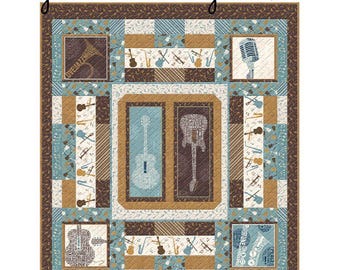 May include: A Rhythm & Harmony Quilt Kit featuring a patchwork design with musical instruments including guitars, saxophones, and trumpets. The quilt displays a color palette of brown, light blue, and cream with various musical motifs and text.