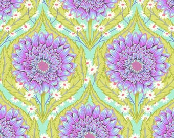 May include: A repeating pattern of large, stylized purple and pink gerbera daisies with green leaves and small white flowers on a light green background. The design has a symmetrical, floral motif, suitable for fabric or wallpaper.