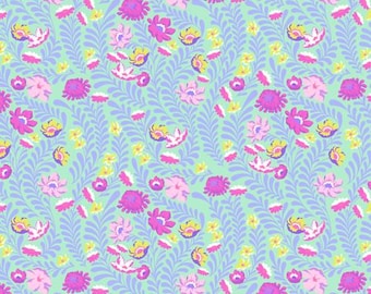 May include: A floral fabric with a light green background. The pattern features pink, purple, and yellow flowers, along with purple leaf-like designs. The fabric has a repeating pattern. The bottom of the fabric has a ruler with inch measurements.