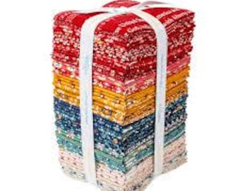 May include: A stack of folded fabric squares bundled together with a white ribbon. The fabric features various floral and geometric patterns in a color palette of red, orange, yellow, blue, teal, and cream. The top fabric has visible white text.
