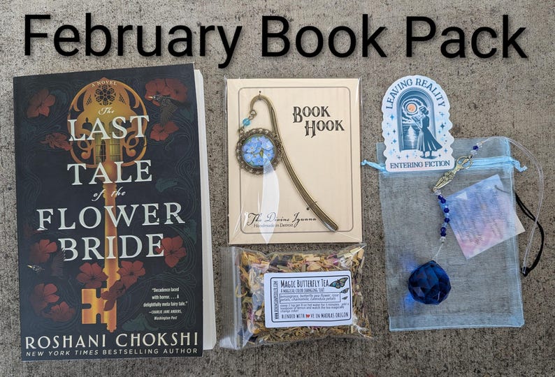 May include: A February Book Pack including a book titled "The Last Tale of the Flower Bride", a bookmark, a tea bag, a blue crystal, and a sticker with the text "Leaving Reality Entering Fiction".