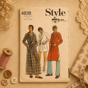 May include: A vintage "Style" sewing pattern with illustrations of men's robes. The pattern includes sizes 38-40 and the text "MEDIUM MOYEN". The cover is cream-colored with a price code of "S" and "R225" in South African currency.