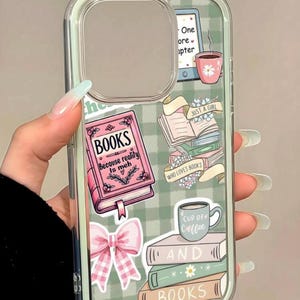 May include: Clear phone case with a green and white gingham pattern. The case features book-themed stickers, including a pink book with the text "BOOKS Because reality is meh", a stack of books, and a coffee cup. A pink bow is also included.