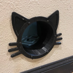 Tunnel pour chats à travers le mur