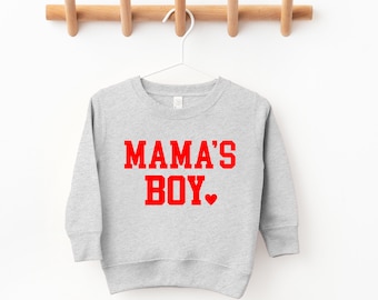 May include: Gray sweatshirt with red text that reads "MAMA'S BOY" with a red heart.
