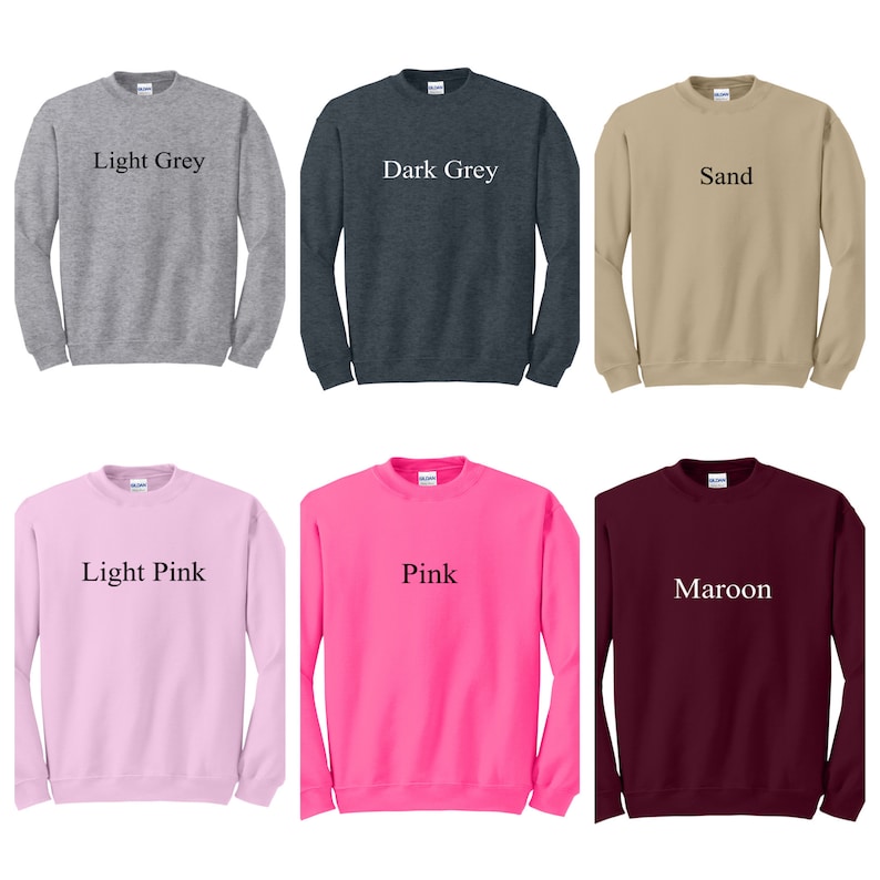May include: Six crewneck sweatshirts in different colors: light grey, dark grey, sand, light pink, pink, and maroon. Each sweatshirt has a single word printed on the front in black text: "Light Grey", "Dark Grey", "Sand", "Light Pink", "Pink", and "Maroon".