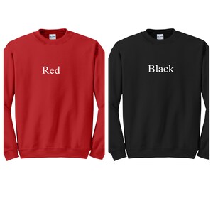May include: Two long-sleeved sweatshirts, one red and one black, with the words "Red" and "Black" printed on the front.