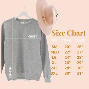 May include: Size chart for a gray sweatshirt with measurements in inches for chest and length. The chart shows sizes from small to 3XL.