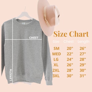 May include: Size chart for a gray sweatshirt with measurements in inches for chest and length. The chart shows sizes from small to 3XL.