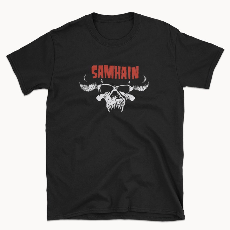 May include: Black t-shirt with a white skull and horns graphic and the word "SAMHAIN" in red letters.