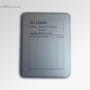 May include: A gray card with the text "EX LIBRIS" printed on it. The card has a title section, an author section, and a table with columns for "Date Due", "Borrower's Name", and "Returned".