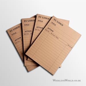 May include: A set of four light brown library checkout cards arranged in a fan shape. Each card features black printed text including EX LIBRIS, TITLE, AUTHOR, Date Due, Borrower's Name, and Returned, along with a grid of horizontal lines.